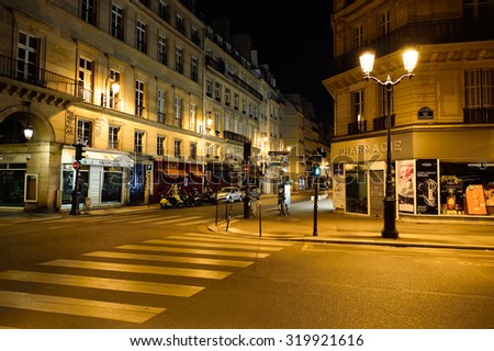PARIS, FRANCE - AUGUST 11, 2015: Paris streets at night. Paris, aka City of Love, is a popular travel destination and a major city in Europe