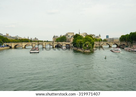 PARIS, FRANCE - AUGUST 09, 2015: tourists sail in the ship. Paris, aka City of Love, is a popular travel destination and a major city in Europe