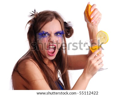 sexy cruel woman squeeze a orange. isolated on white