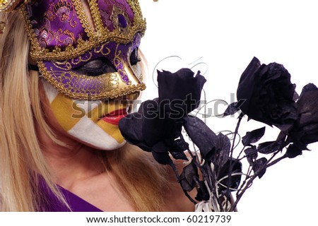 pretty young woman in violet mask sniff black roses, isolated on white, may be use for Venice concept