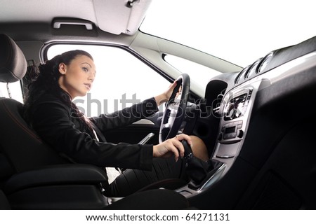 beauty young businesswoman drive the car. you can set any background in place of white windows