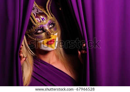 sexy woman in violet mask open curtain