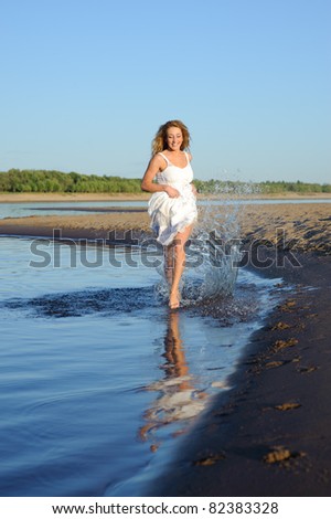running glad beauty woman in white dress