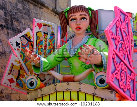 A carnival float of a lady luck with playing cards