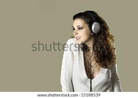 Portrait of a young beautiful sexy woman listening music