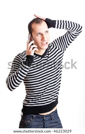 Young man talking on cellphone and worried with something, isolated on white background