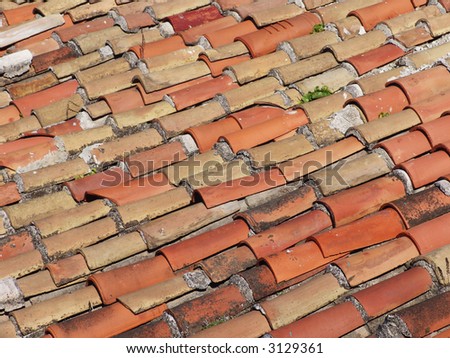 A closeup of red tiles on a roof