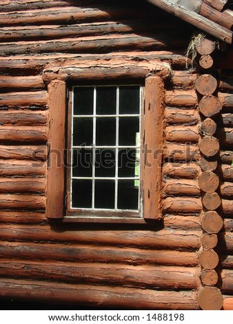 the side window on a log cabin