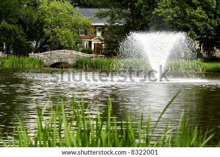 a fountain splashing in a local park
