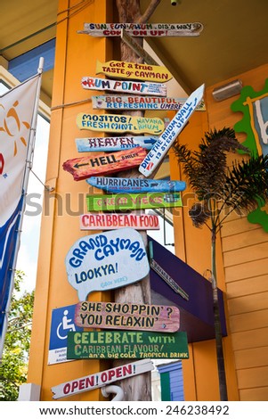 GEORGETOWN, GRAND CAYMAN - MARCH 25, 2009:  Grand Cayman is a popular travel destination in the Caribbean and this is a sign in the heart of the tourist district.