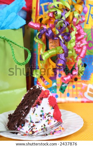 piece of birthday cake with presents