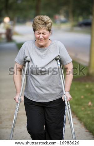 woman on crutches with pain