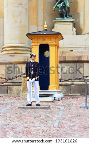 STOCKHOLM, SWEDEN - AUGUST 13, 2013: Royal Guard protecting Royal Palace in Stockholm. The Life Guards is a combined cavalry infantry regiment of the Swedish Army founded in 1521