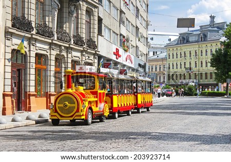 LVIV, UKRAINE - JUNE 30, 2014: Sightseeing car train  in the center of Lviv, Ukraine