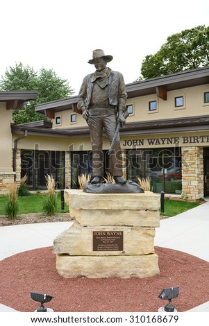 WINTERSET, IOWA - AUGUST 20, 2015: Statue of John Wayne at the John Wayne Birthplace Museum. The museum opened to the public in May of 2015.