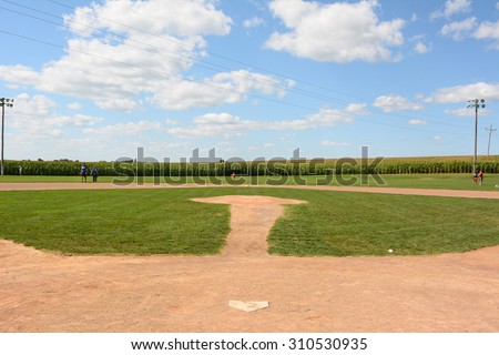 DYERSVILLE, IOWA - AUGUST 20, 2015: Field of Dreams movie set. Children and adults on the diamond of the 1989 movie set.