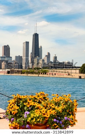 CHICAGO, ILLINOIS - AUGUST 22, 2015: Chicago skyline seen from Navy Pier. The John Hancock Center the 6th tallest building in the USA rises above surrounding structures.