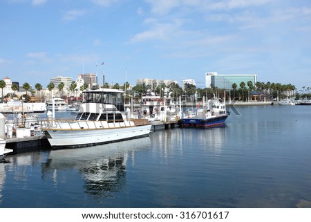 LONG BEACH, CA - FEBRUARY 21, 2015: Boats at Rainbow Harbor. Rainbow Harbor is a popular Southern California Destination of tourist and locals.