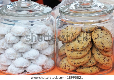 Two Glass Cookie Jars with Chocolate chip and powdered sugar