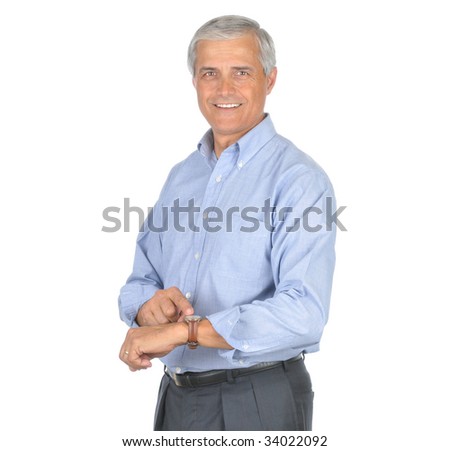 Smiling Middle Aged Businessman Pointing at his Wrist Watch isolated on white