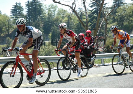 RUNNING SPRINGS, CA - MAY 21: Three cyclists tackle Stage 6 of the Amgen Tour of California on May 21, 2010. The Tour of California is the largest cycling event in America.