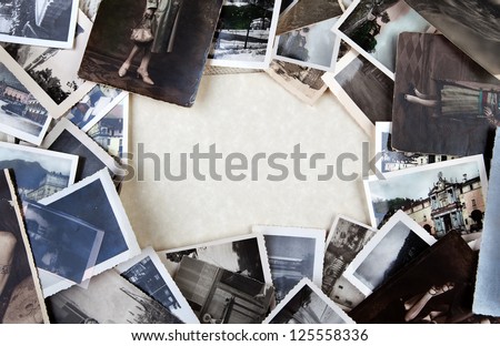 Stack of old photos with space for your logo or text.