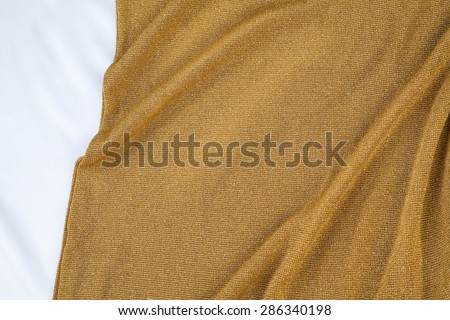 Gold  fabric (detail of golden jersey dress)