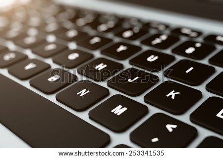 Close up of modern notebook black keyboard