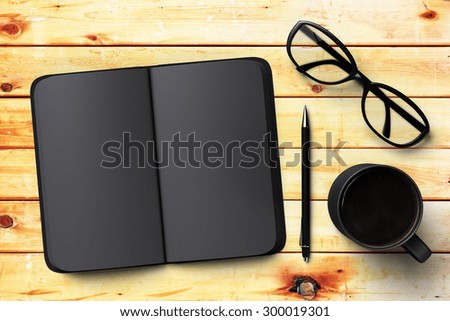 black blank notebook, cup of coffee and glasses, mock up