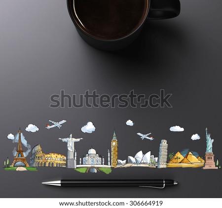 travel landmarks with cup of coffee and pen
