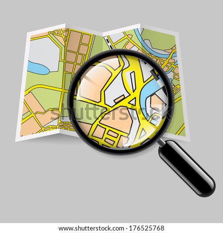 City map booklet with magnifying glass on grey background