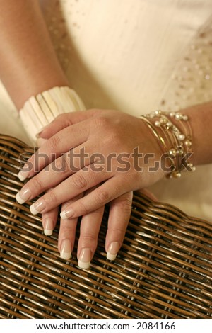 Brides hands on a chair back