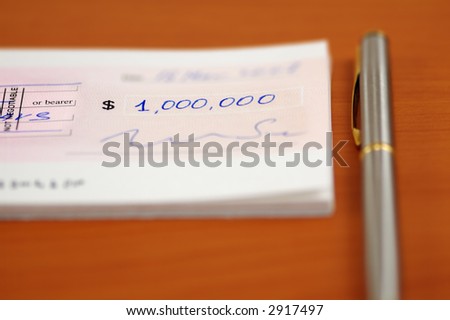 Signed one million dollars cheque and a pen