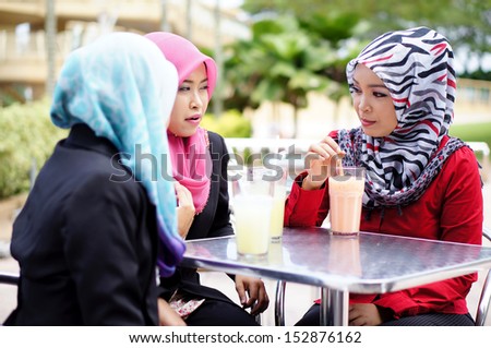 Muslim girl enjoy having conversation at restaurant