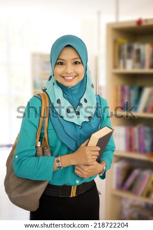 Portrait of Muslim student in the library