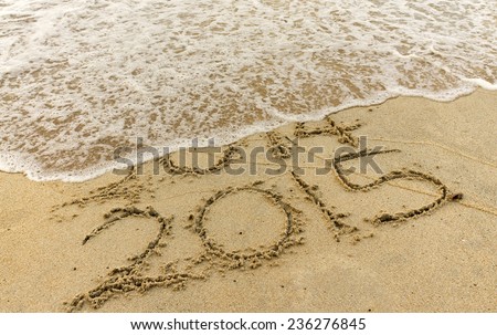 Happy New Year 2015 replace 2014 year concept on the beach