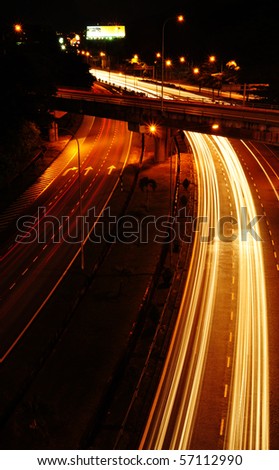 Light trail at a busy highway