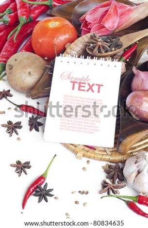 Empty open recipe book with sample text and food ingredients