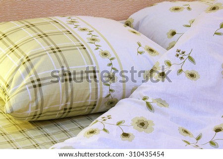 Close up of bedding sheets and pillow on bed