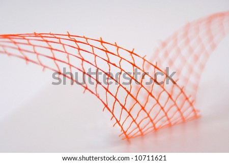 Closeup of orange wavy decoration (net, wire)