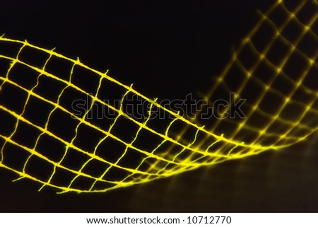 Closeup of yellow wavy decoration (net, wire)
