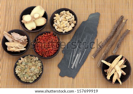 Acupuncture needles with chinese herbal medicine selection over bamboo.