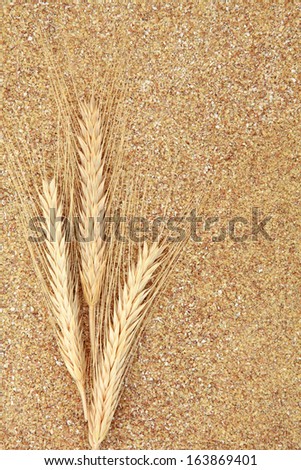 Wheat germ with wheat ears forming a textured background.