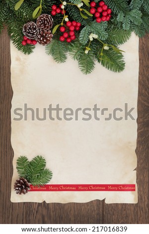 Merry christmas background border with fir, red berry sprays, mistletoe and pine cones over old parchment paper and oak wood.