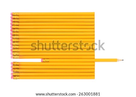 Lead pencils with one pencil sharpened and protruding over white background.