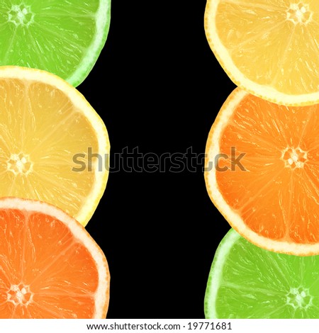 Abstract of lemon, lime and orange citrus fruit slices in two vertical lines, over black background.