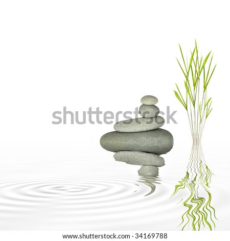 Spa massage treatment stones in perfect balance and bamboo leaf grass with reflection in rippled water, over white background.