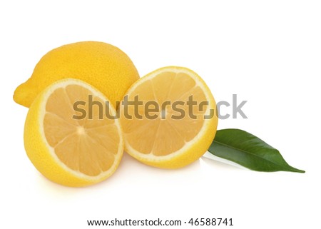 Lemon fruit whole and in half with leaves, isolated over white background with reflection.