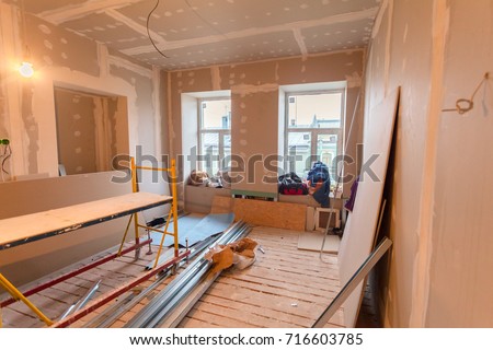 Material for repairs in an apartment is under construction, remodeling, rebuilding and renovation. Making walls from gypsum plasterboard or drywall. 商業照片 © 