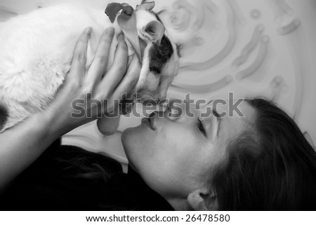 Young fashion model kiss her cat